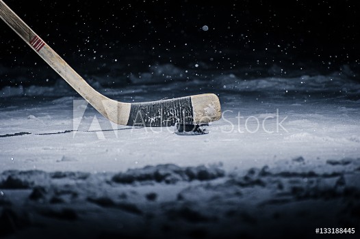 Picture of Hockey Stick and Puck on the Ice Rink